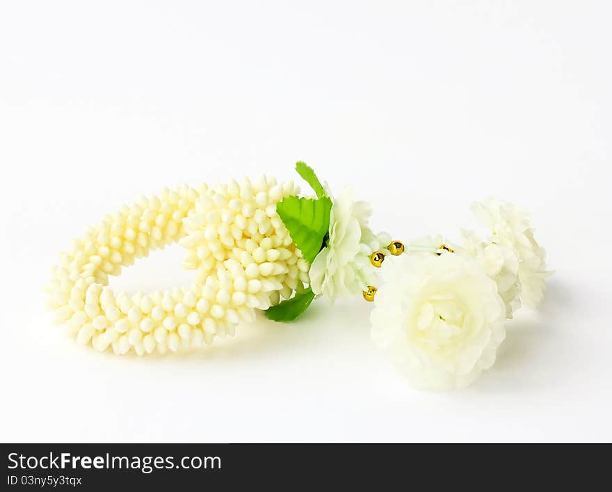 Jasmine garland on a white background (craft plastic, not natural)