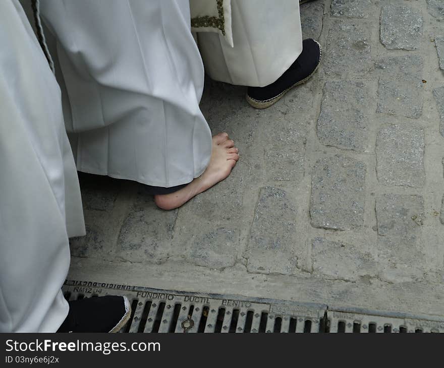 Detail of Easter in Baeza, Spain. it's the barefoot of a penance