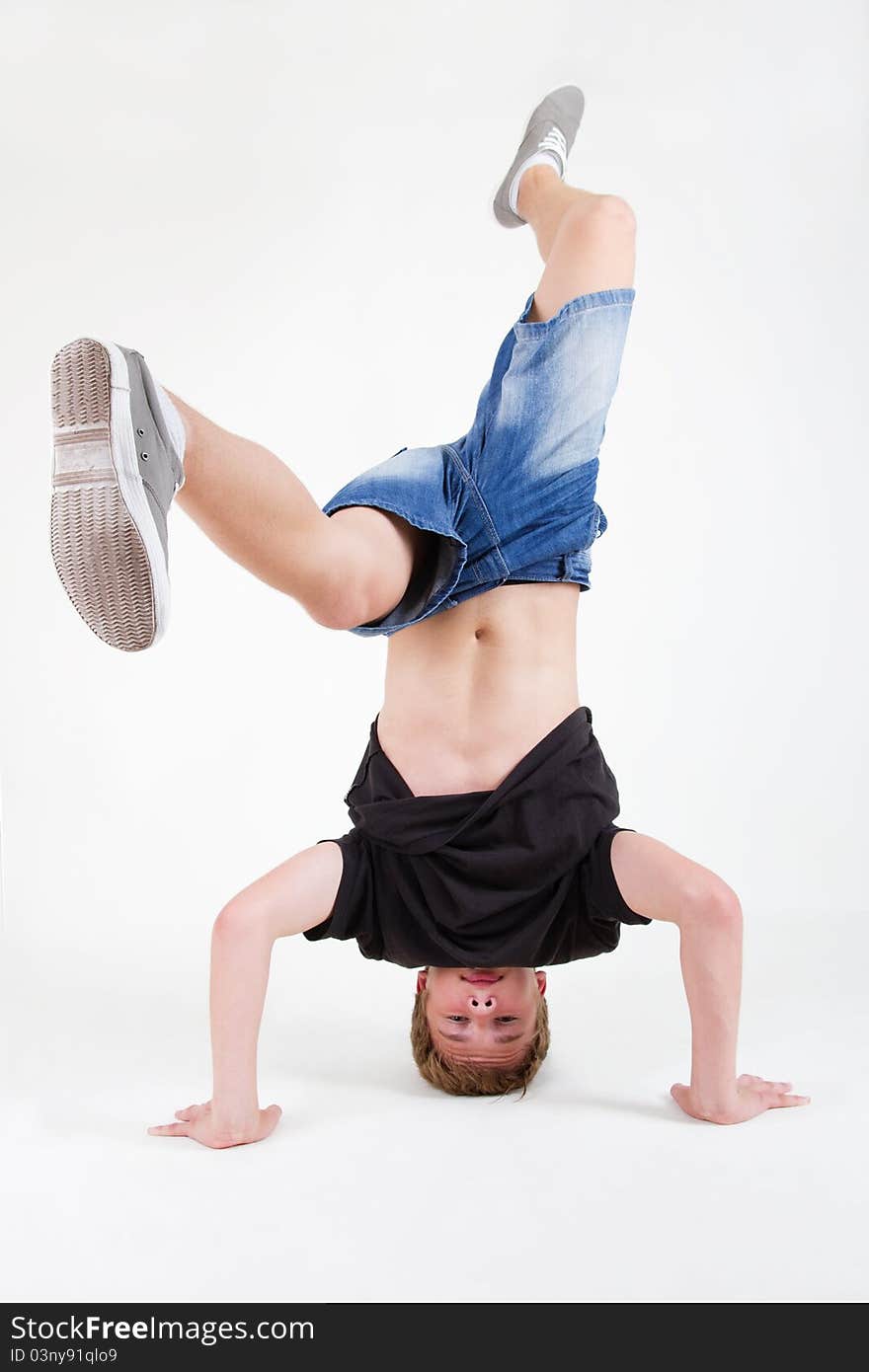 Teen b-boy spinning on his head