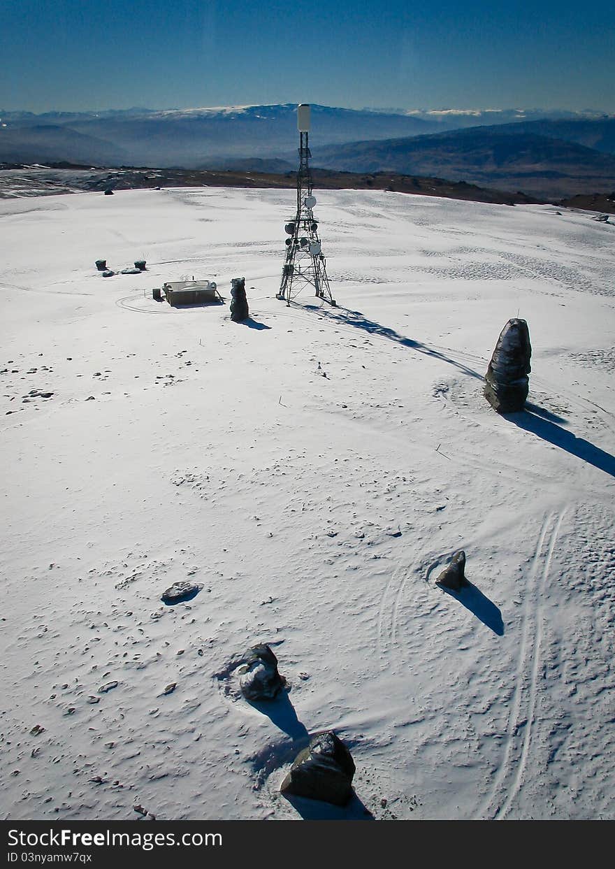 Tower on Snow Covered Mountain