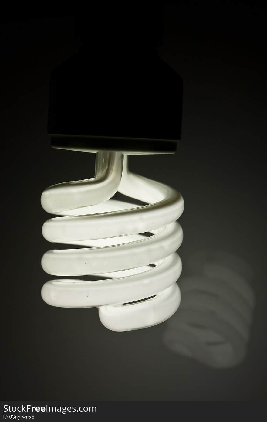 Energy saving light bulb on background