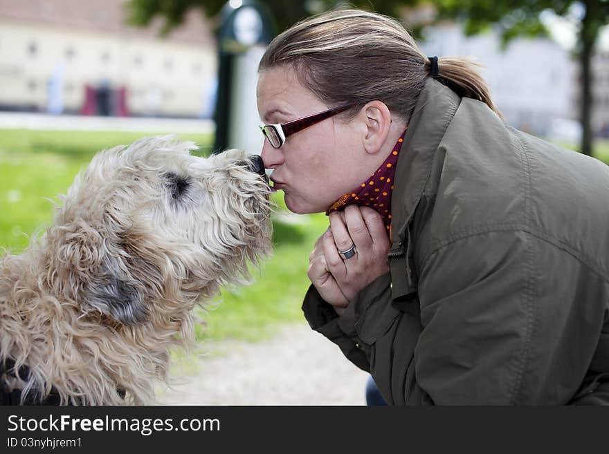 Woman and her dog with love in the park. Woman and her dog with love in the park