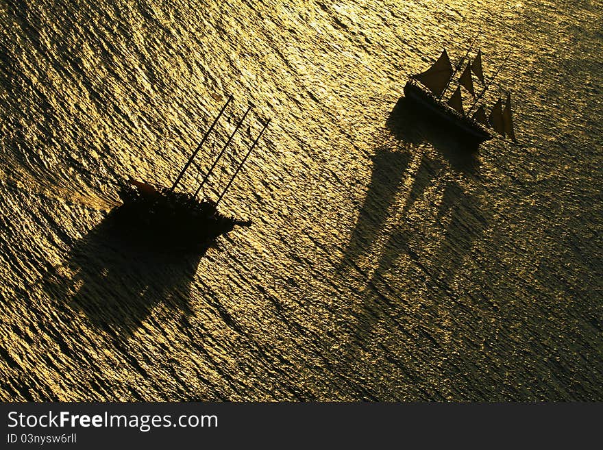 Two sail boats carrying tourists to see the stunning sunset in Santorini island, Greece. Two sail boats carrying tourists to see the stunning sunset in Santorini island, Greece