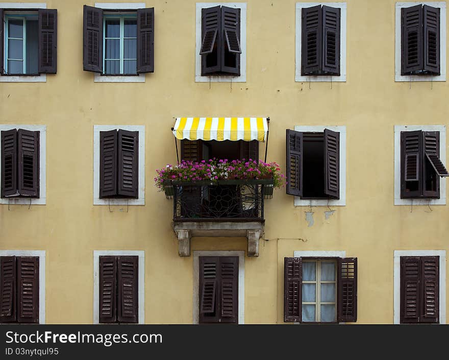 Classic italian windows with flowers. Classic italian windows with flowers