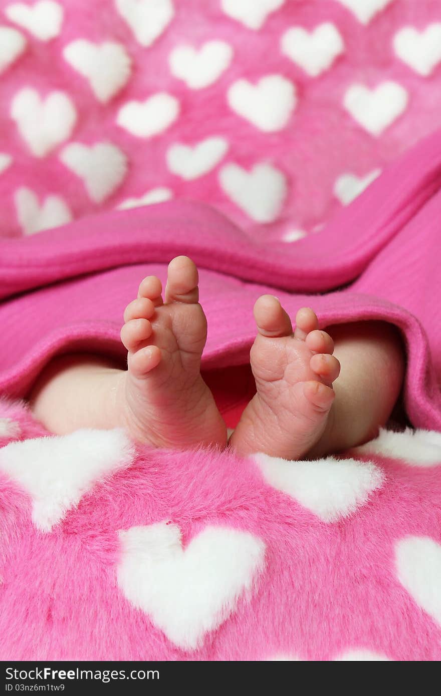 Small baby holding parents hand on blue background. Small baby holding parents hand on blue background