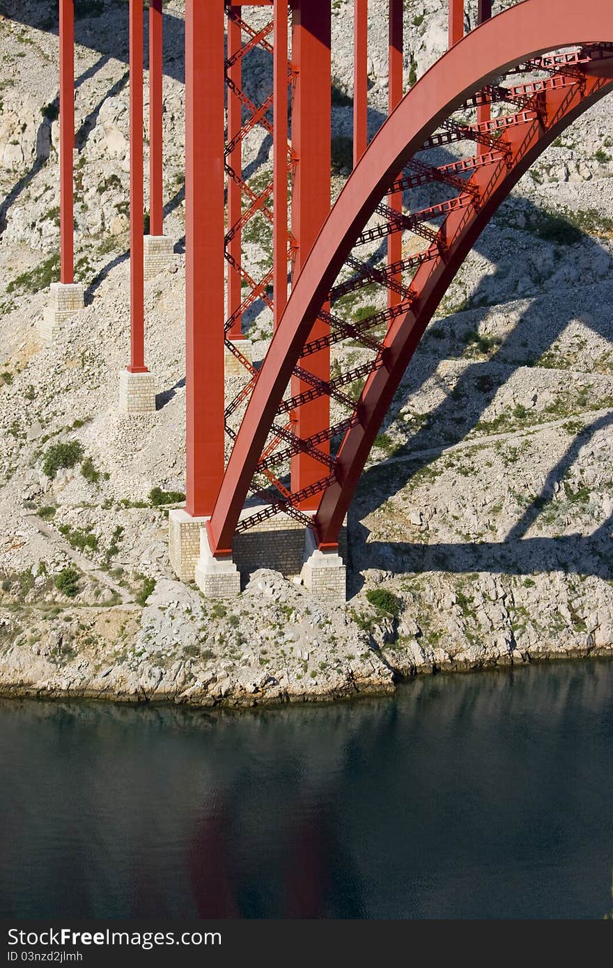 A part of the construction of the Maslenica bridge, o rocky slope and the blue sea. A part of the construction of the Maslenica bridge, o rocky slope and the blue sea