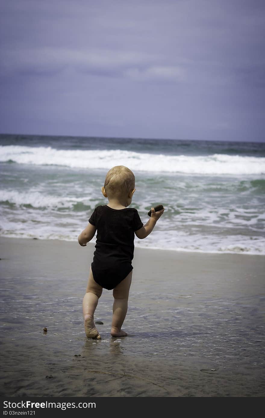 Toddler playing at the beach