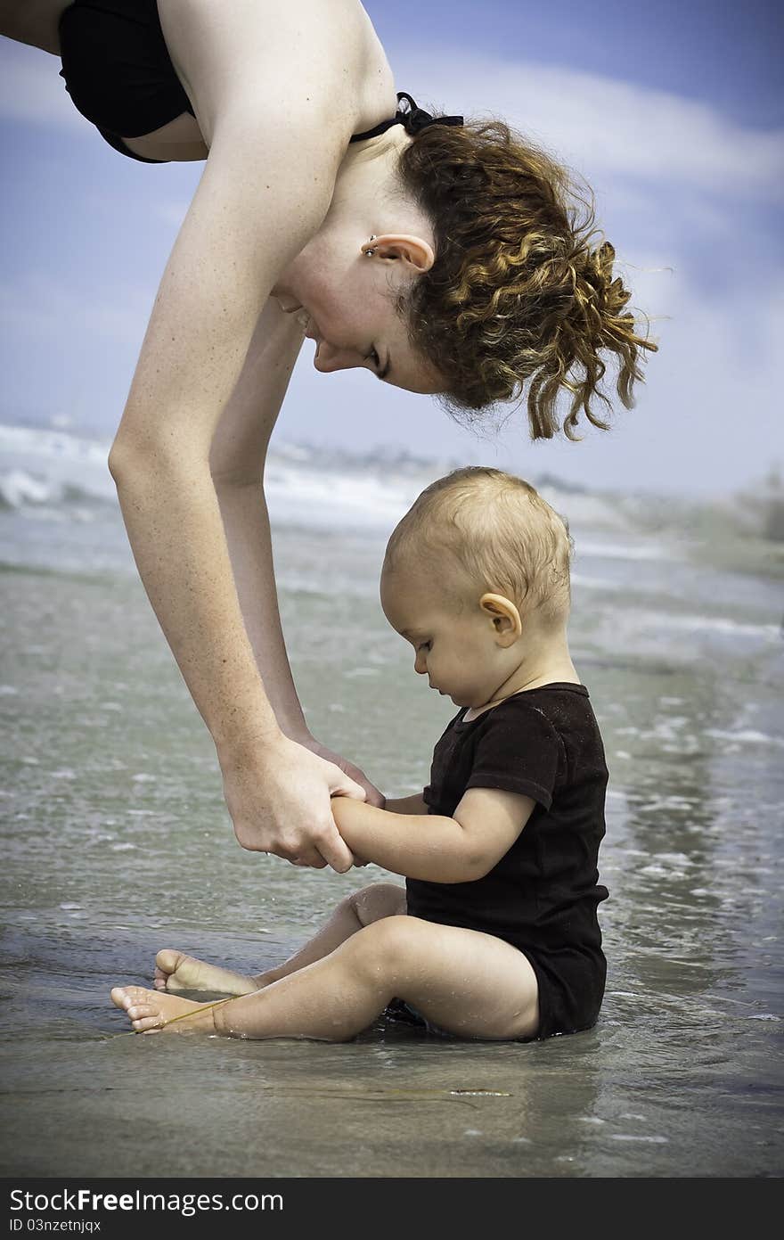 A toddler exploring the beach for the first time. A toddler exploring the beach for the first time