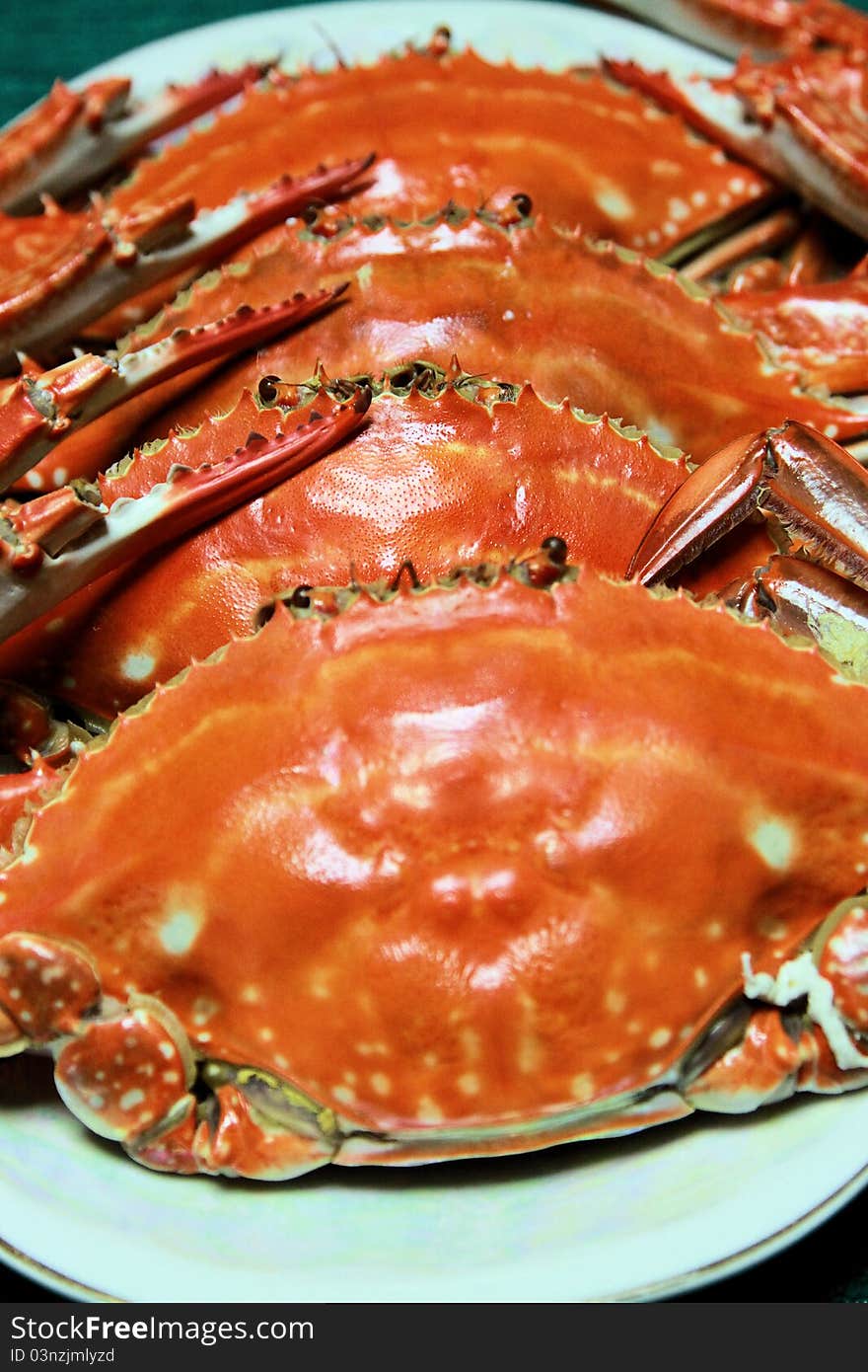 Steamed cook red crabs on a plate close up shot