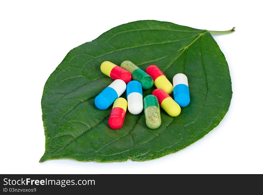 Pills on leaf.