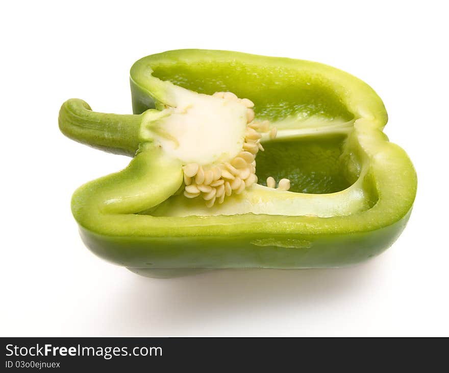 Close-up of green paprika on white background