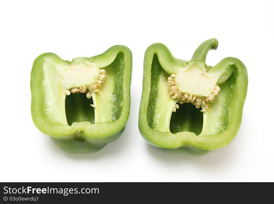 Close-up of green paprika on white background