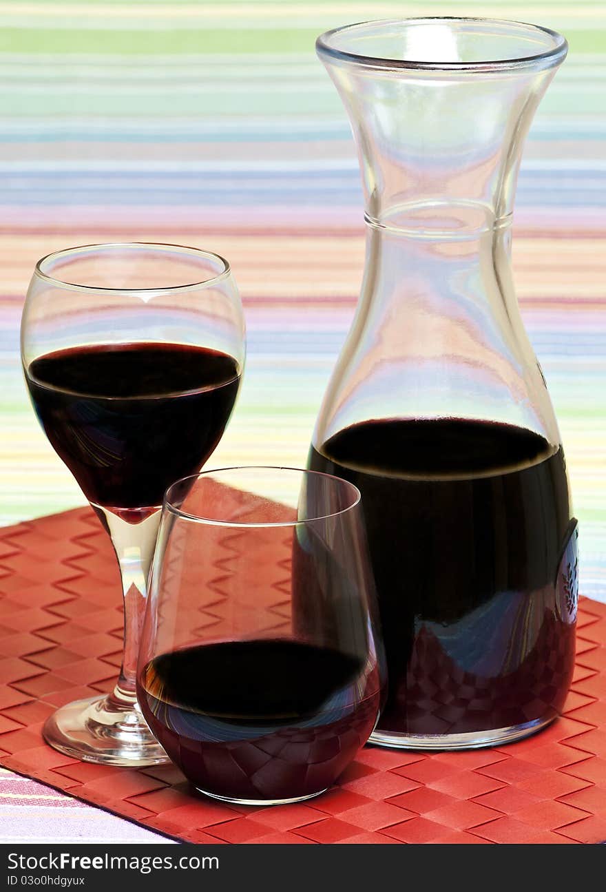 A carafe and glasses of red wine