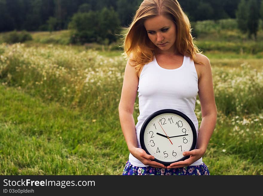 Young Woman With A Wall Clock