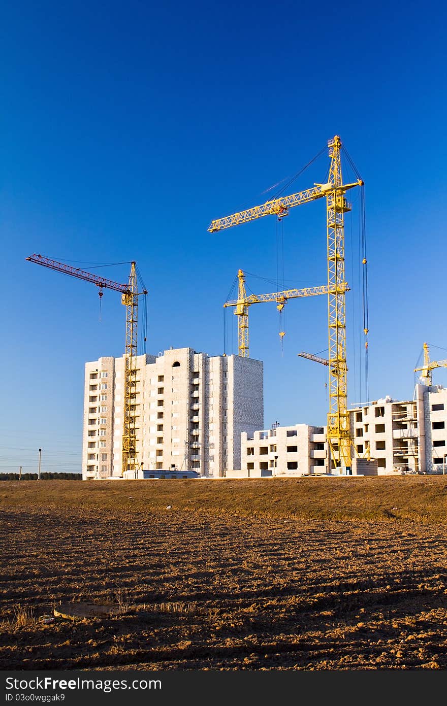 Building of many-storeyed houses in new microdistrict in a city