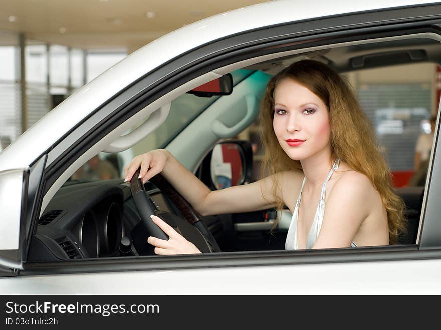 Beautiful woman at the car