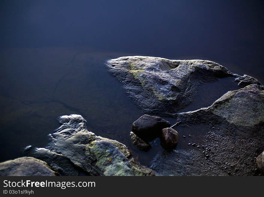 Lake's shore - Coastal stones at twilight. Lake's shore - Coastal stones at twilight