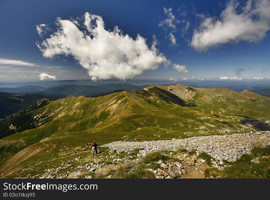 Climber in mountain and clouds