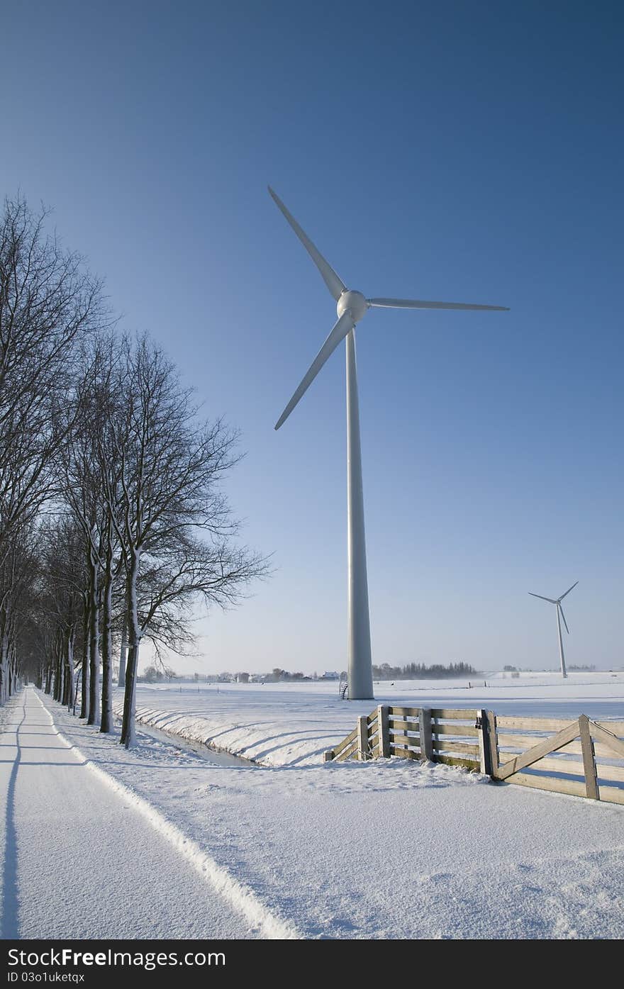 Wind Turbines In Winter Landscape