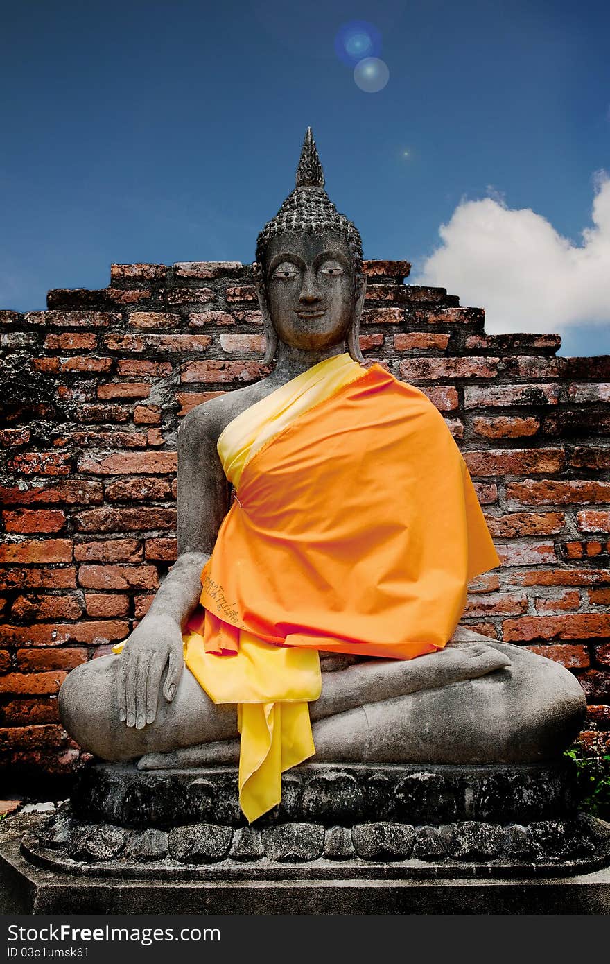 Image of Buddha in brick background