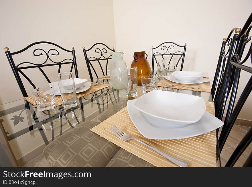 Interior design glass dining table and chairs in a house. Interior design glass dining table and chairs in a house
