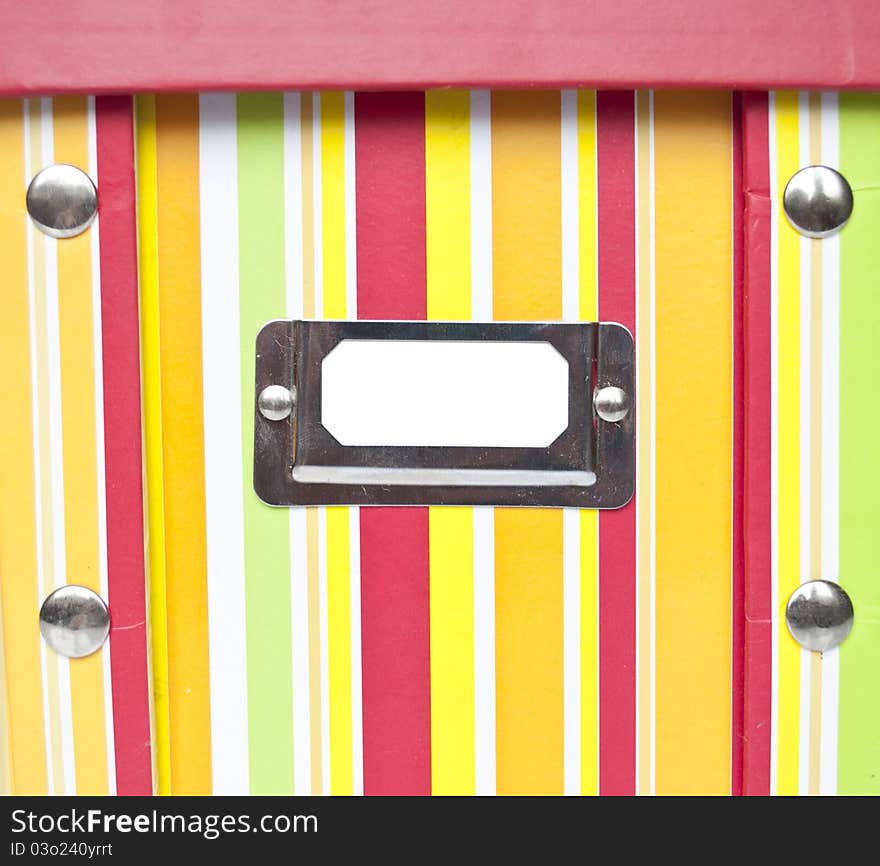 Colorful paper box with empty tag and space for your text