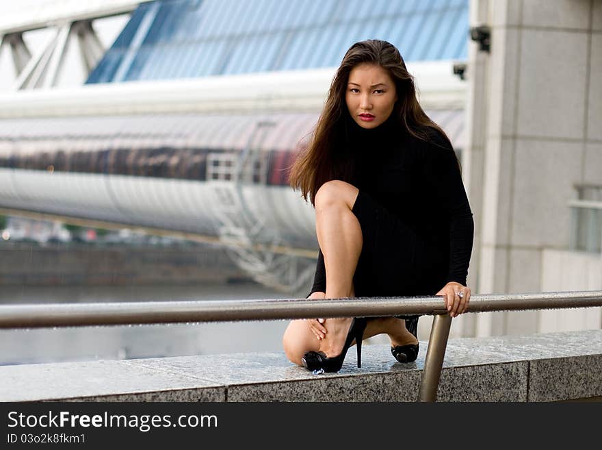 Sexy girl in black dress walking