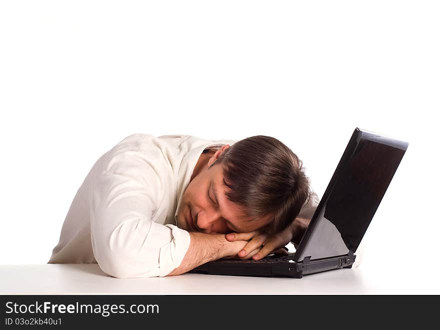 Cute young man with a computer on white. Cute young man with a computer on white