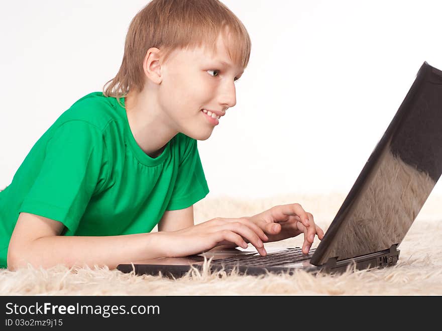 Portrait of a young boy with laptop