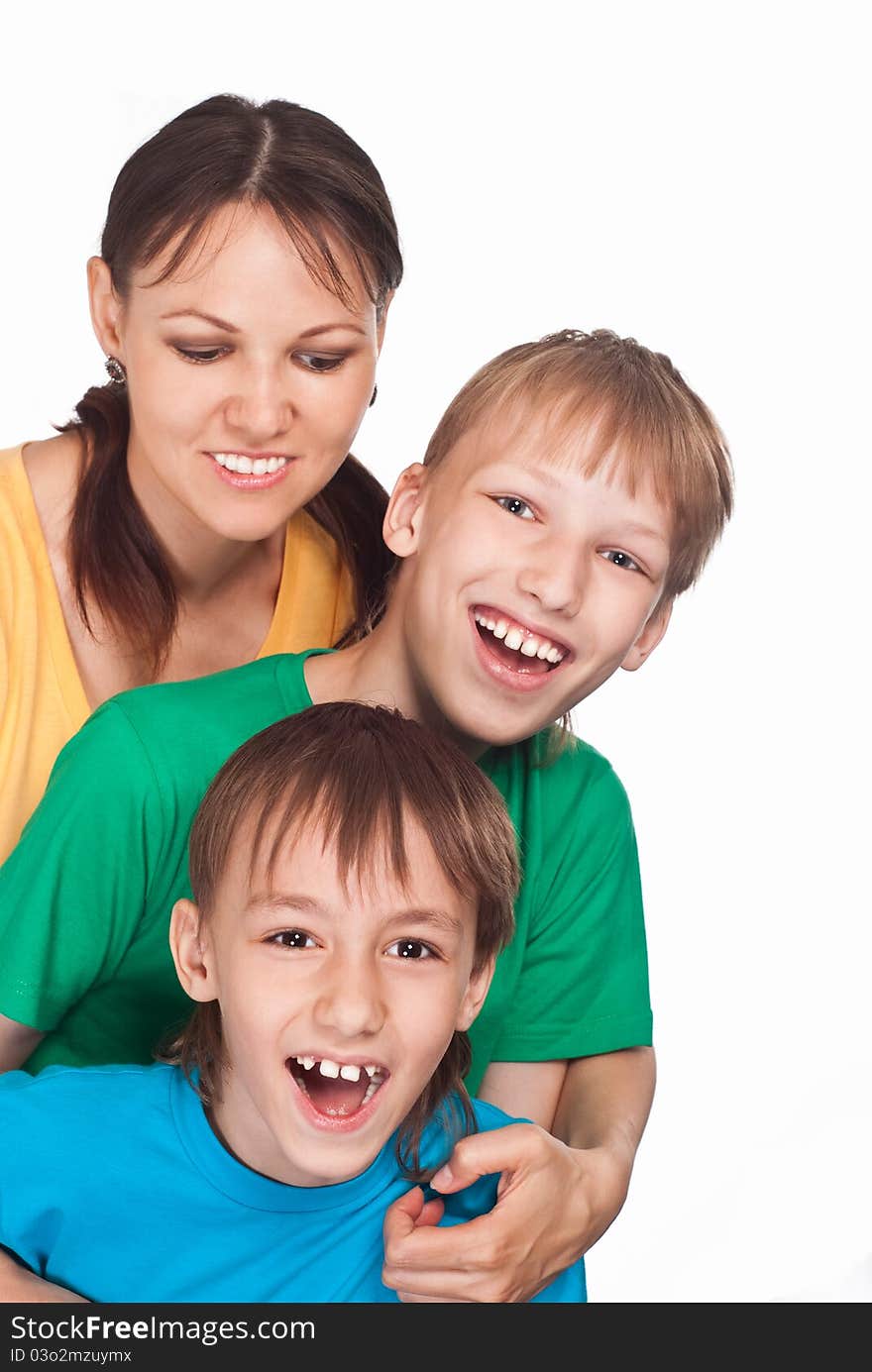 Cute mom with her boys on a white. Cute mom with her boys on a white