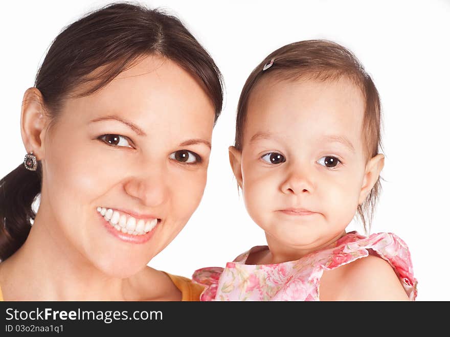 Cute mom with her daughter on a white. Cute mom with her daughter on a white