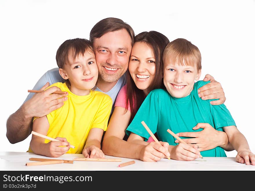 Nice family draws at table on white. Nice family draws at table on white