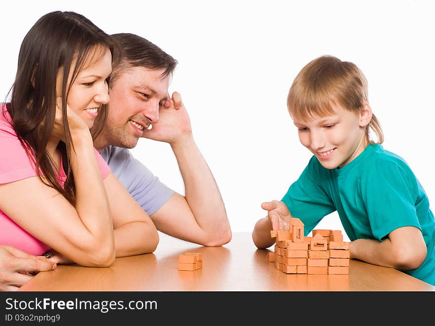 Cute Family Playing At Table