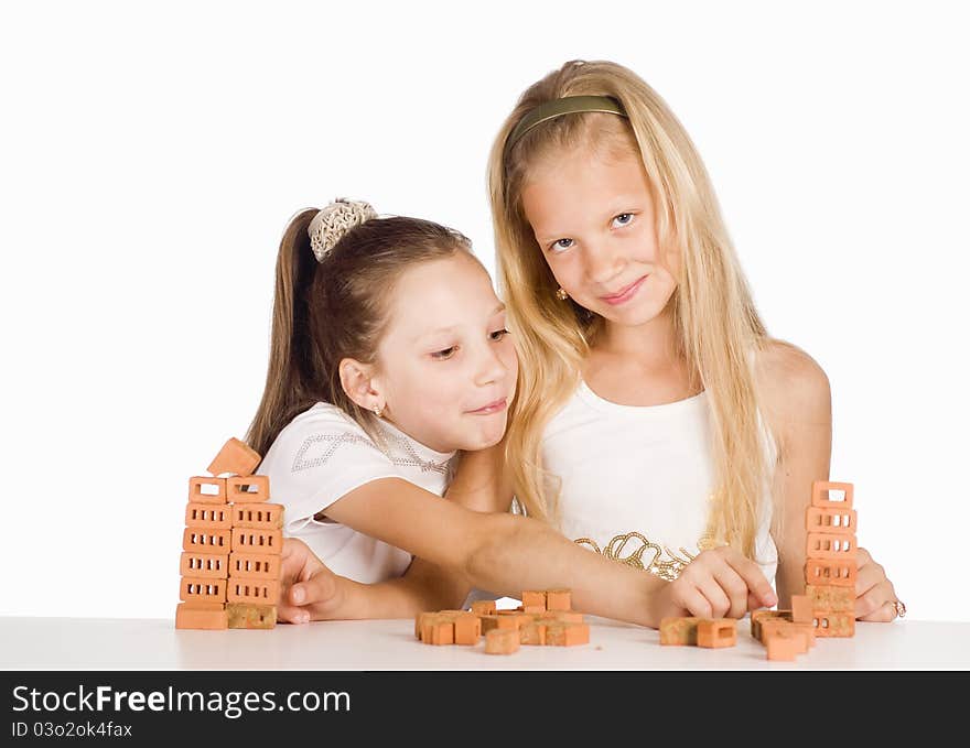 Portrait of a two little sisters at table. Portrait of a two little sisters at table