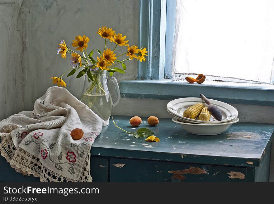 Bouquet of flowers and boiled corn