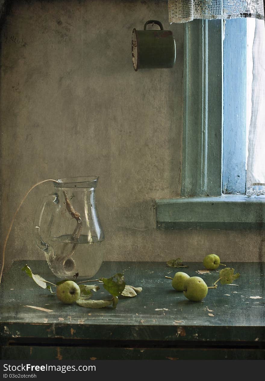 Green apples and old immersion heater are in a jug. Green apples and old immersion heater are in a jug