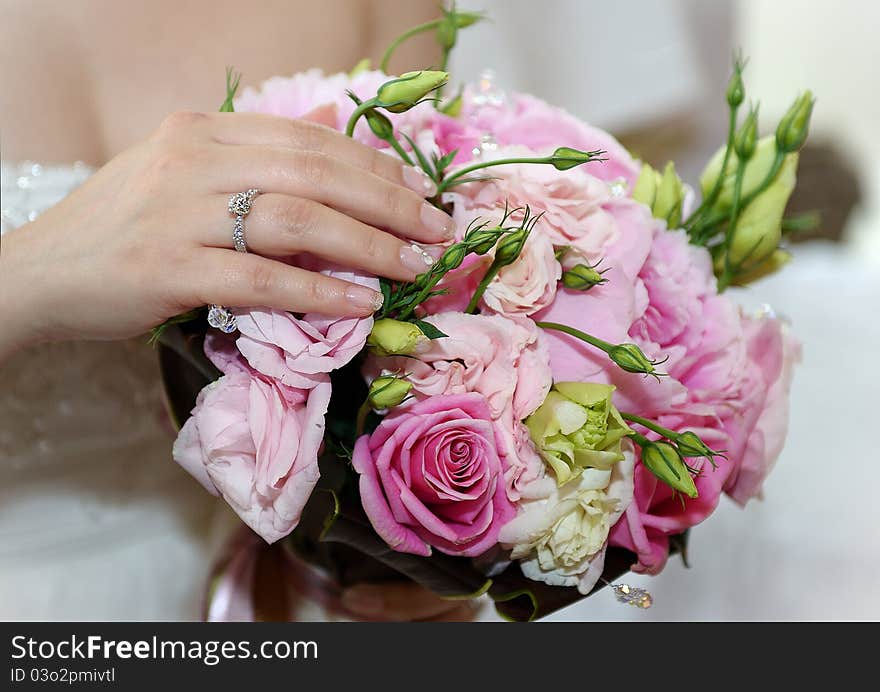 A relax bride with her roses. A relax bride with her roses.