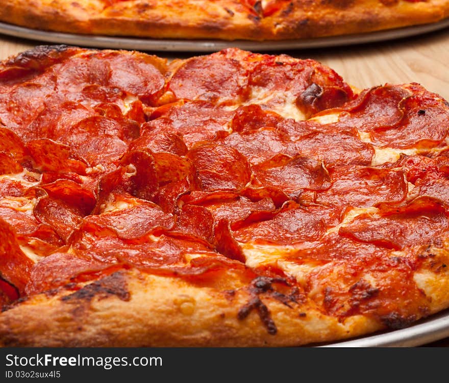 A very tempting image of a delicious pepperoni pizza. This image is a closeup to add uniqueness to the photograph.