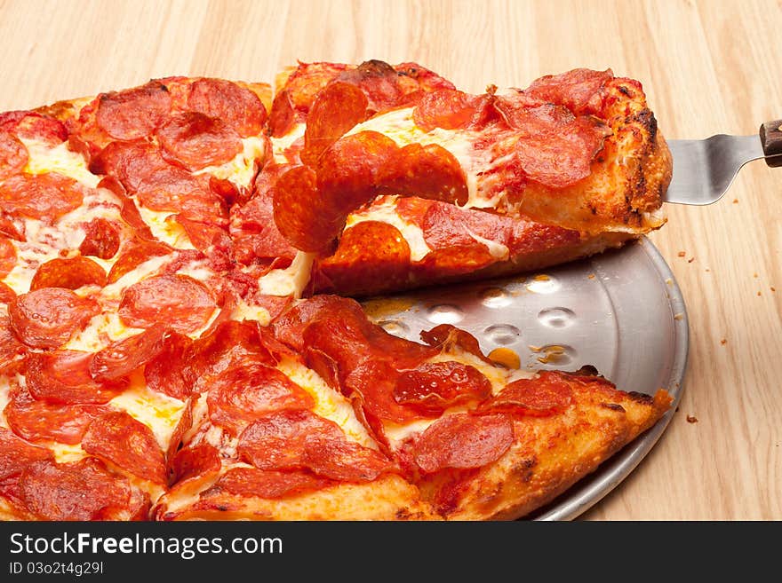 A very tempting image of a delicious pepperoni pizza. This image is a closeup to add uniqueness to the photograph.