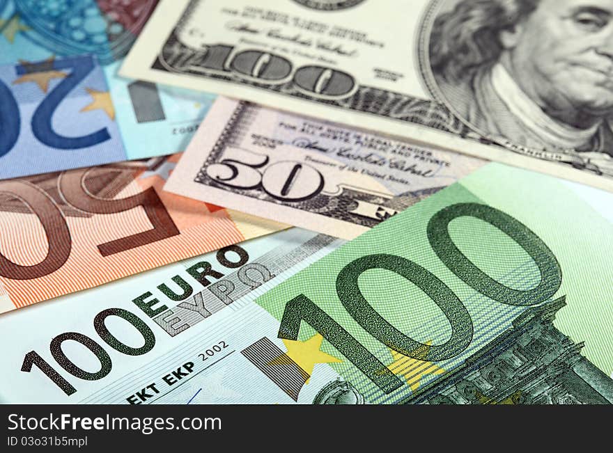 Money: euro and dollar banknotes