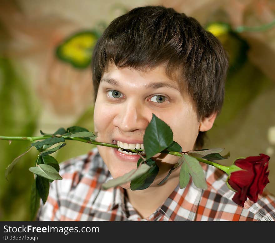 Young handsome man with rose. Young handsome man with rose