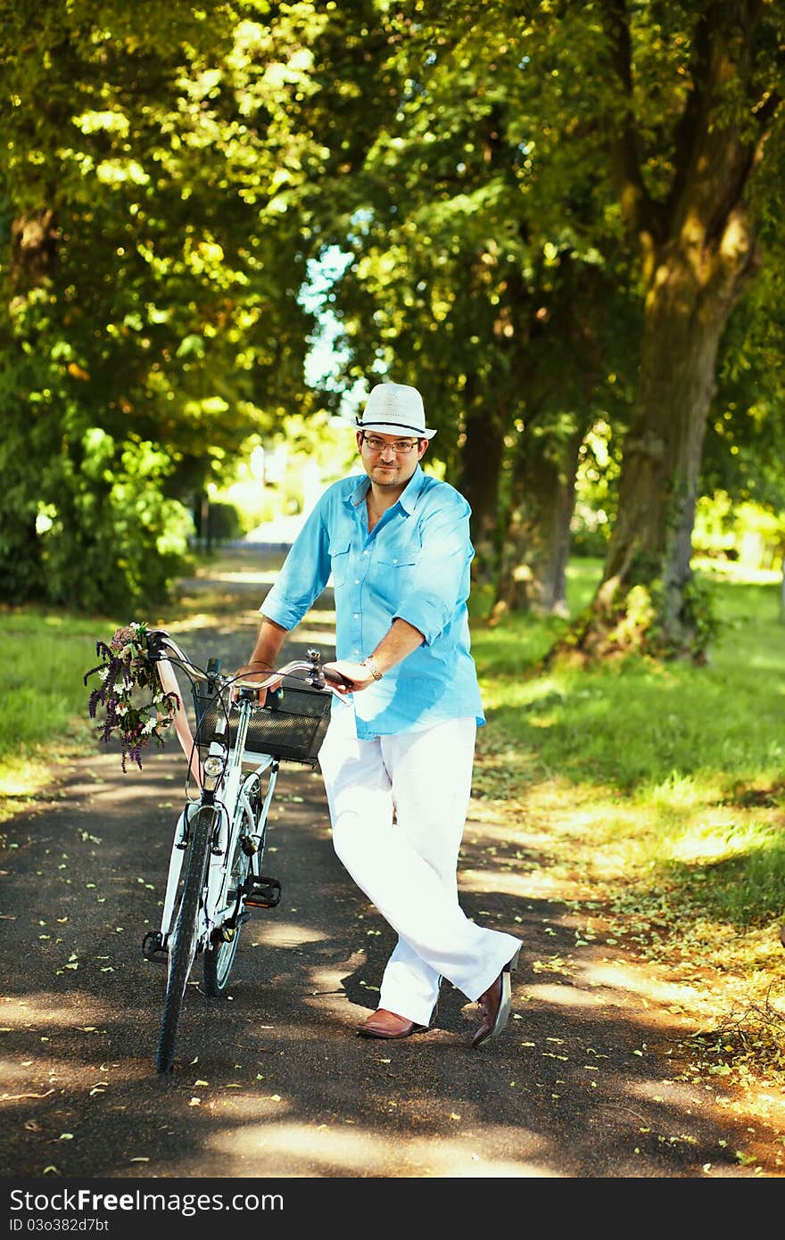 Romantic Man Standing With Bicycle In The Park