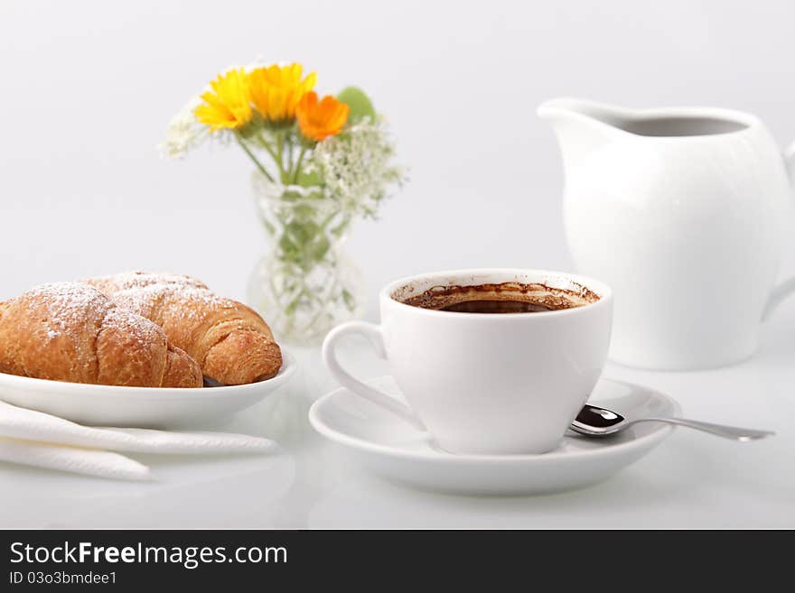 Breakfast with coffee and croissant. Breakfast with coffee and croissant