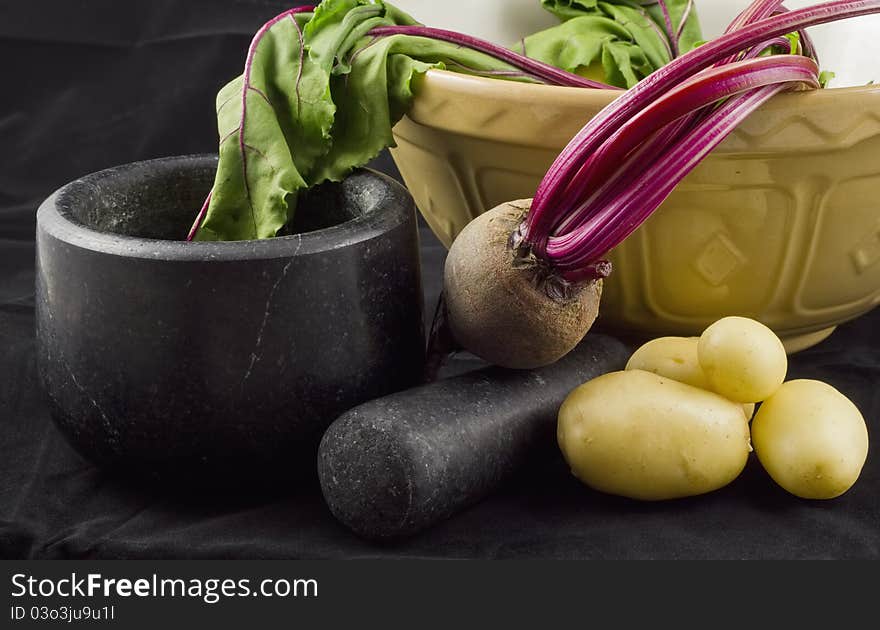 Beetroot, potatoes, mortar and pestle