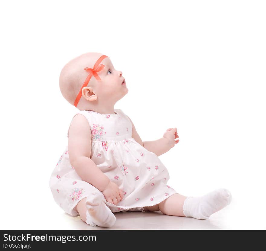 Sweet baby girl looking at something. Isolated over white background. Sweet baby girl looking at something. Isolated over white background.