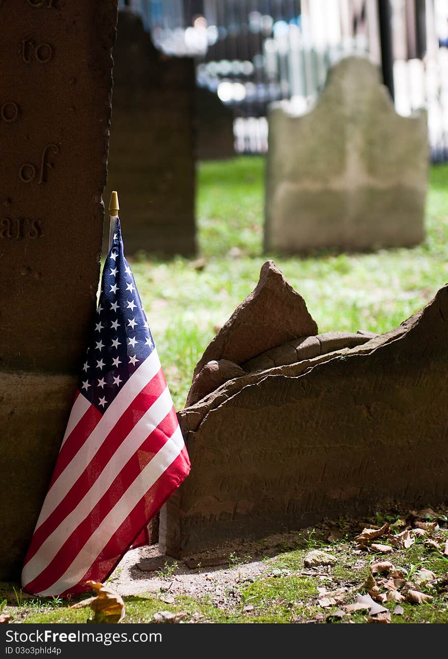 Graveyard with American flag in St Paul's churchyard near ground zero area New York City