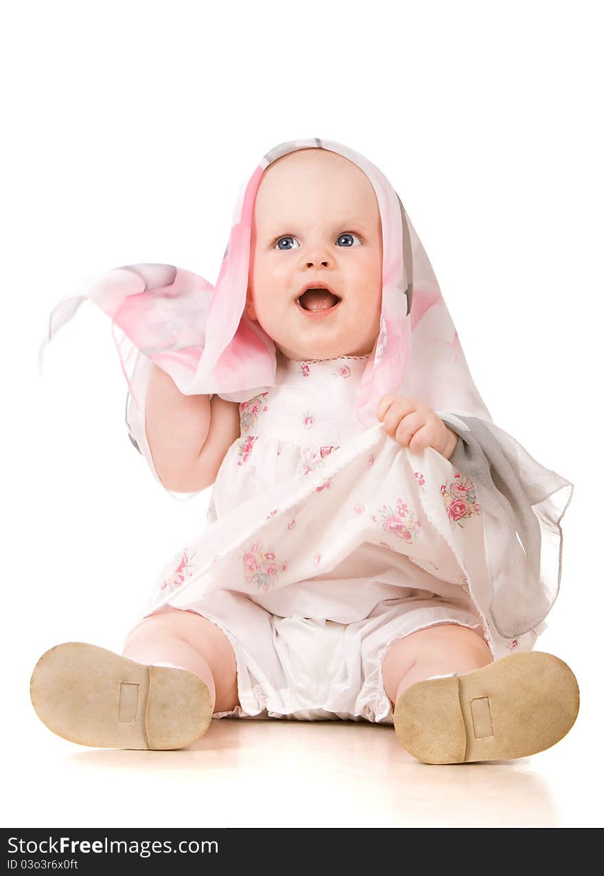 Baby girl playing with scarf. Over white background