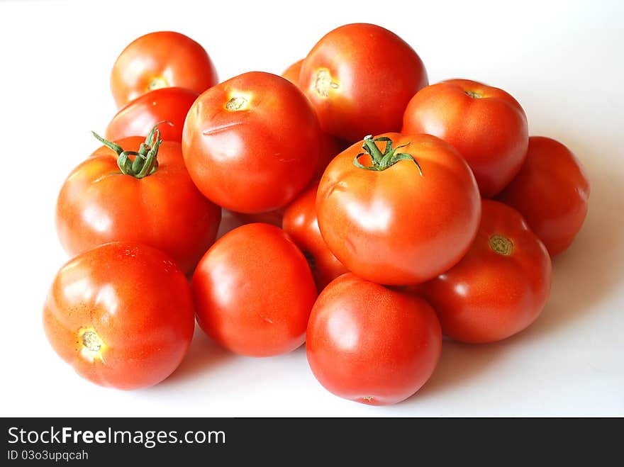 Fresh tomatoes on white background