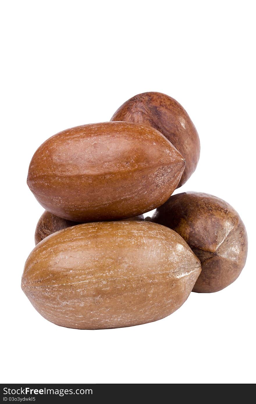 Few shelled pecan nuts isolated on a white background.