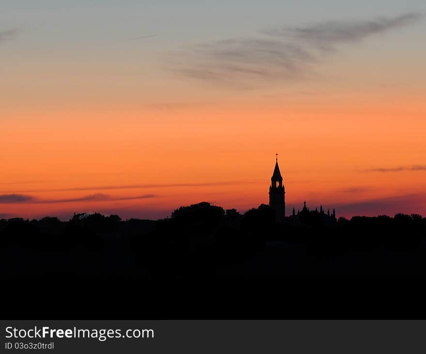 Sunet behind the skyline of a town. Sunet behind the skyline of a town